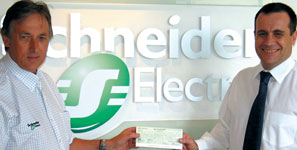 Dudley Miller of Schneider Electric (left) presents Paulo da Silva of SAIMC with the student sponsorship